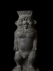 Hand Carved Basalt Stone God Bes Statue - Image 1