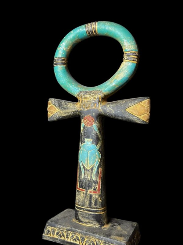 cross key of life with Scarab beetle symbol and sun disk.
